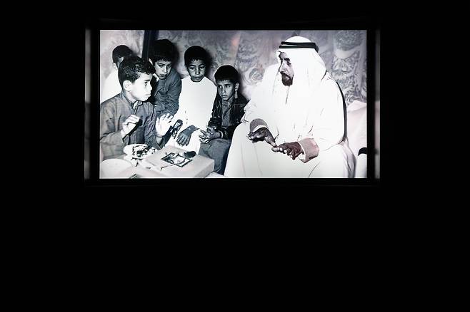 A photo of Sheikh Zayed bin Sultan Al Nahyan, the founding father of the United Arab Emirates, displayed inside the "Our Beginning" gallery at the Zayed National Museum [ZAYED NATIONAL MUSEUM]