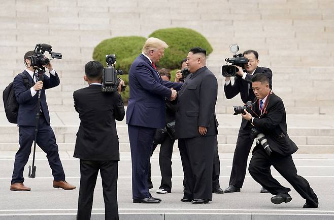 U.S. President Donald Trump meets with North Korean leader Kim Jong-un at the demilitarized zone separating the two Koreas in Panmunjom, South Korea, on June 30, 2019. [REUTERS/YONHAP]