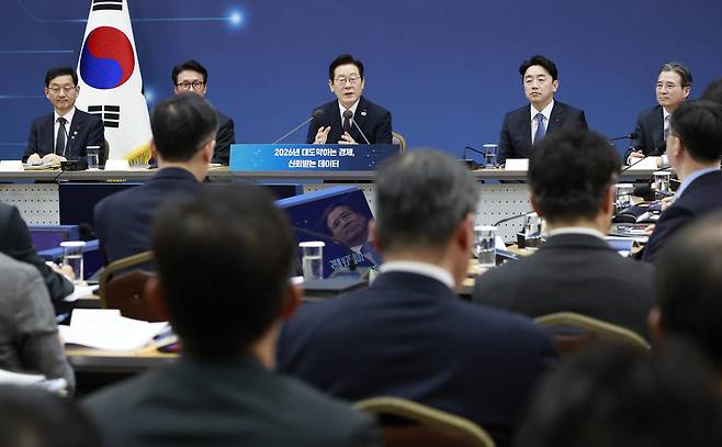 President Lee Jae Myung, center in the back, speaks during a joint policy briefing at the Government Sejong Convention Center in Sejong on Dec. 11. [JOINT PRESS CORPS]