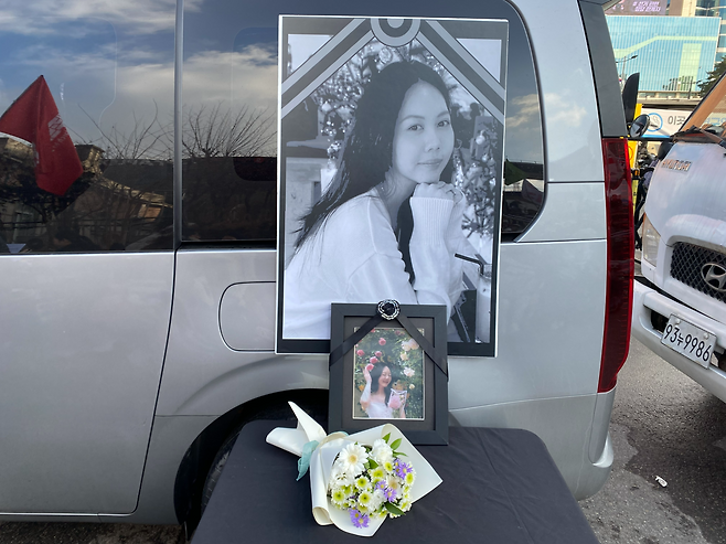 Portraits of Tu Anh, a 25-year-old Vietnamese national who died following a raid by Korea’s immigration authorities at a car parts factory in October, are displayed during a memorial protest Sunday in central Seoul. (Lim Jae-seong/The Korea Herald)