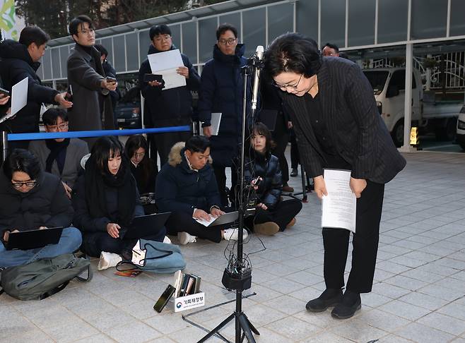 Lee Hye-hoon, the nominee for the new minister for planning and budget, talks to reporters while heading to her office to prepare for her parliamentary confirmation hearing in Seoul on Dec. 30, 2025. [YONHAP]