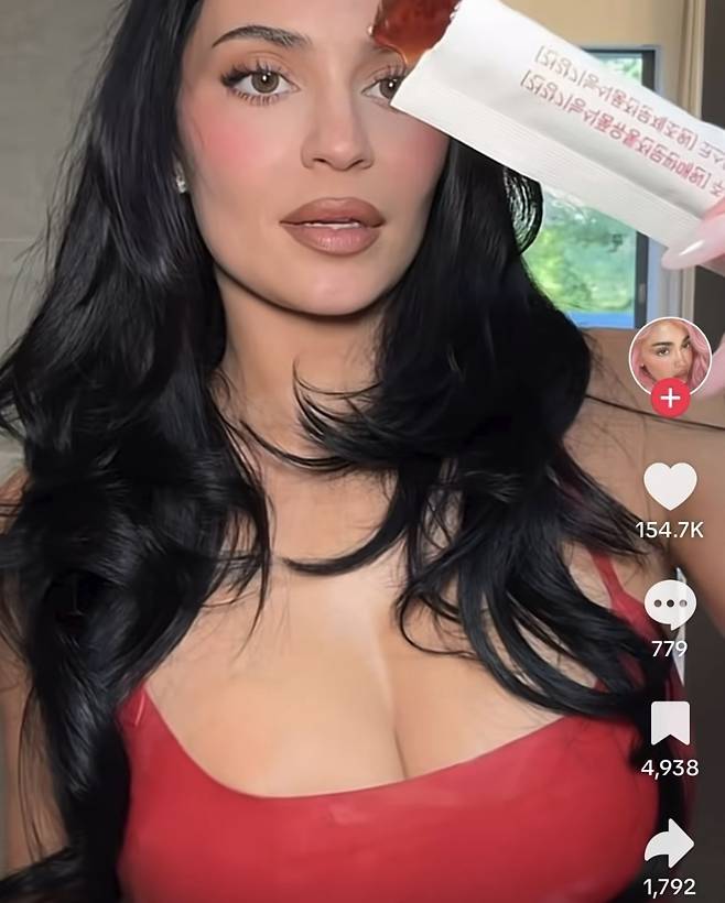 Kylie Jenner shows a pomegranate-flavored cutting jelly from her bag in a recent TikTok post, calling it a new addition to her routine. (TikTok)