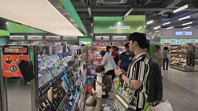 Customers are seen browsing products at an Olive Young store in Jung District, central Seoul, on Sept. 29, 2025. [NOH YU-RIM]