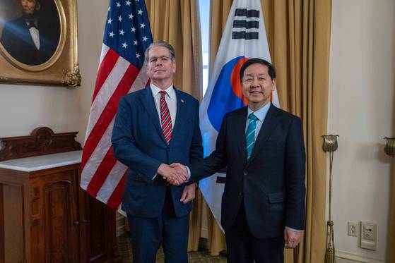 U.S. Treasury Secretary Scott Bessent, left, shakes hands with Finance Minister Koo Yun-cheol in a meeting on Jan. 12 in this photo uploaded onto Bessent's X account. [SCREEN CAPTURE]