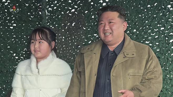 North Korean leader Kim Jong-un, right, and his daughter observe a test launch of the Hwaseong-17 intercontinental ballistic missile on Nov. 18, 2022, in this footage broadcast by the North's state-controlled Korean Central Television. [YONHAP]