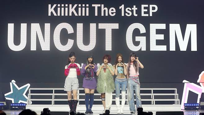 Members of rookie group KiiiKiii pose during their debut showcase for their first mini album “Uncut Gem” at Blue Square in Seoul’s Yongsan District in March 2025. (Newsis)