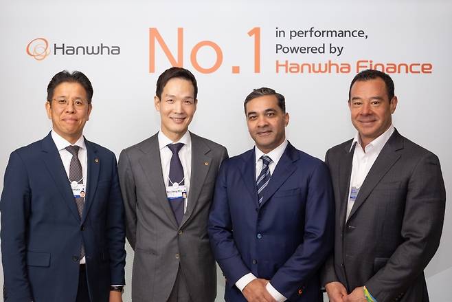 From left: Hanwha Life Chief Investment Officer Lee Byung-seo, Hanwha Life Chief Global Officer Kim Dong-won, Liberty City Ventures Managing Partner Murtaza Akbar and Liberty City Ventures co-founder Emil Woods pose for a photo after signing a memorandum of understanding in Davos, Switzerland, Wednesday. (Hanwha Life)