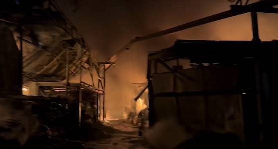 A fire that started at a factory in Gijang County, Busan, spreads to a nearby mountainside on the night of Jan. 21, 2026. [BUSAN FIRE SAFETY HEADQUARTERS]