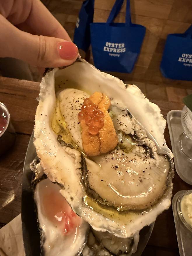 Goheung oyster with uni (Hong Yoo/The Korea Herald)