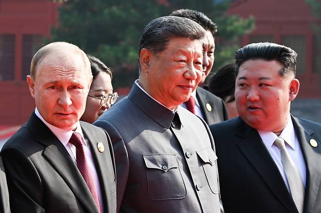 Russian President Vladimir Putin, left, Chinese President Xi Jinping, center, and North Korean leader Kim Jong Un are seen ahead of a military parade marking the 80th Victory Day in Beijing, China, on Sept. 3, 2025. [TASS/YONHAP]