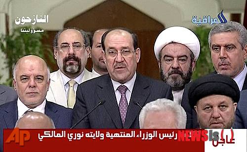 【바그다드=AP/뉴시스】2014년 8월14일 이라크 내외에서 사퇴 압박을 받아온 누리 알 말리키 이라크 총리(가운데)가 3선 연임 도전 포기를 발표하는 장면.  그는 올해 1월 24일 시아파 연합에 의해 새 총리로 지명돼 세번째 총리직을 맡게 되었다. 2026. 01. 25.