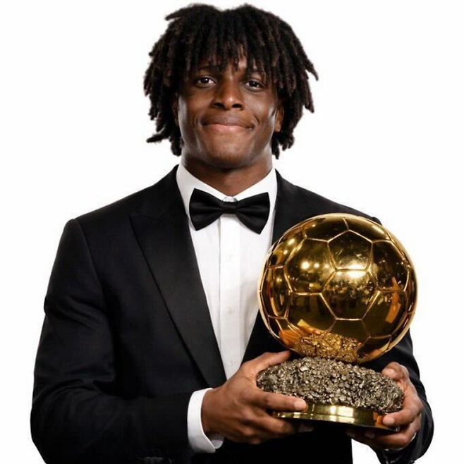 맨체스터 유나이티드 소속의 파트리크 도르구. 트로피를 들고 있는 합성 사진이다. [사진 SNS 갈무리]