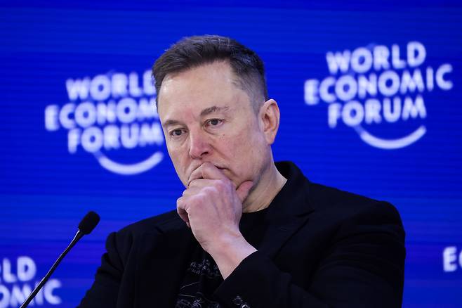 Teslsa CEO Elon Musk ponders during the World Economic Forum in Davos, Switzerland, Jan. 22. (Bloomberg)