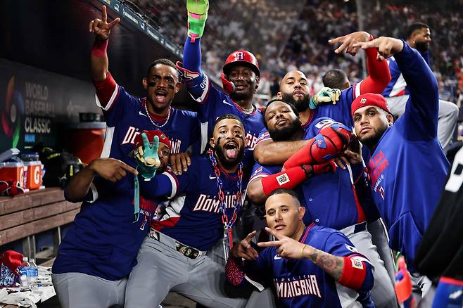 MIAMI, FLORIDA - MARCH 11: Fernando Tatis Jr. of the Dominican Republic celebrates with teammates Vladimir Guerrero Jr. #27Geraldo Perdomo #2, Manny MacHado #3 , and Julio Rodriguez #44 after hitting a home run during the fourth inning against Venezuela at loanDepot park on March 11, 2026 in Miami, Florida.   AFP연합뉴스