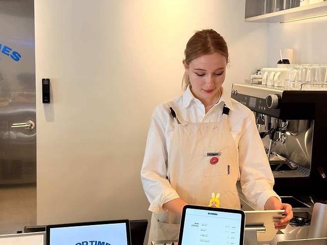 Lea Maxima Septinus from Germany makes coffee at a cafe. [LEA MAXIMA SEPTINUS]