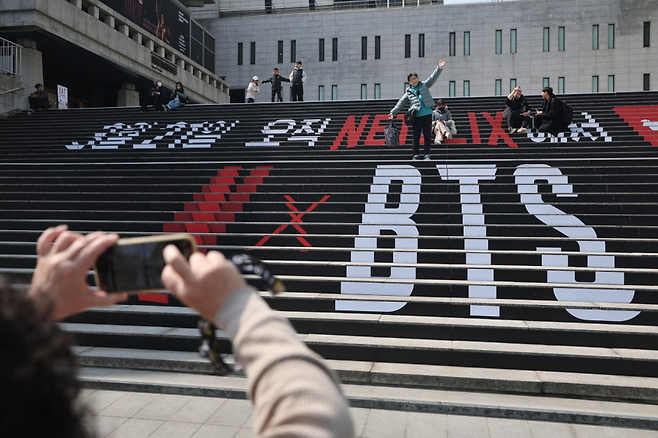 Promotional messages for BTS’s comeback concert are displayed on the steps of the Sejong Center for the Performing Arts in Seoul on Tuesday. (Yonhap)