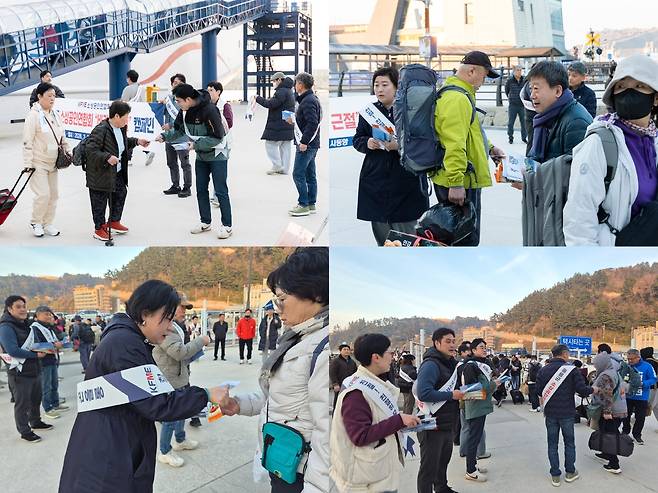 “친절한 울릉도, 우리가 앞장섭니다” 울릉군 소상공인연합회 회원들이 새벽 항구에서 ‘바가지 요금 근절과 친절 문화 확산’을 위한 캠페인을 펼치고 있다. /황진영 기자