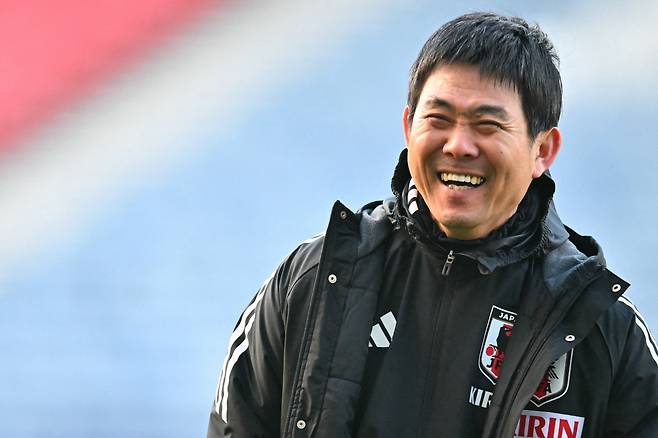 TOPSHOT - Japan's Head Coach Hajime Moriyasu smiles during a team training session at Hampden Park, in Glasgow, on March 27, 2026, on the eve of their international friendly football match against Scotland. (Photo by ANDY BUCHANAN / AFP)







<저작권자(c) 연합뉴스, 무단 전재-재배포, AI 학습 및 활용 금지>