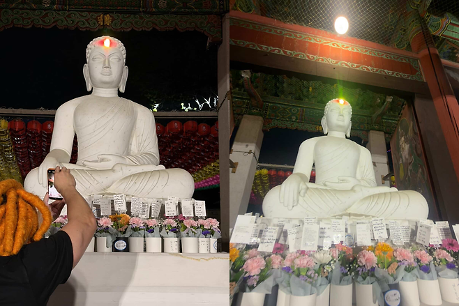 A strobe light from the stage shines directly at the center of a Buddha statue’s forehead, prompting visitors to pause and take photos as they exit the temple after the party. (Courtesy of @dreadyamada)