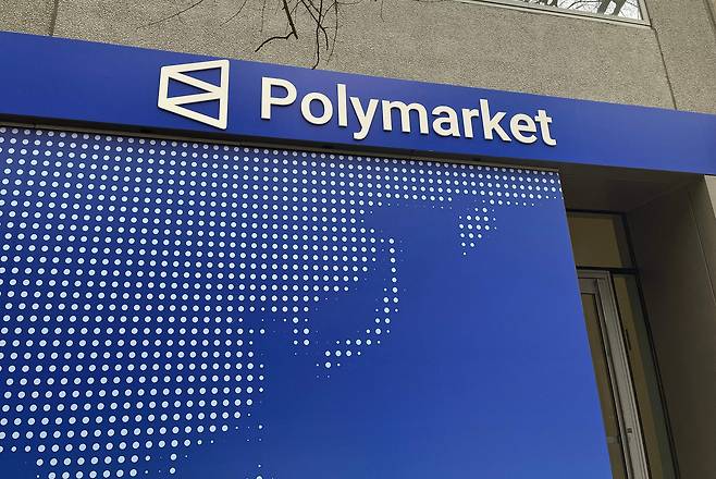 The logo of the online prediction market Polymarket is outside of the company's new location, called ″The Situation Room,″ during its opening day in Washington on March 20. [AFP/YONHAP]