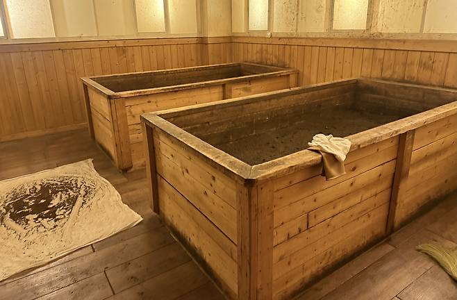 Wooden containers are filled with enzymes. [WOO JI-WON]