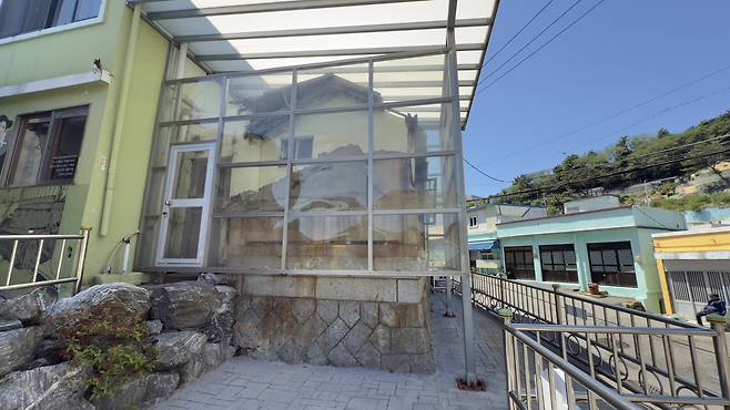 A house built atop former cemeteries in Ami-dong Tombstone Village [WOO JI-WON]