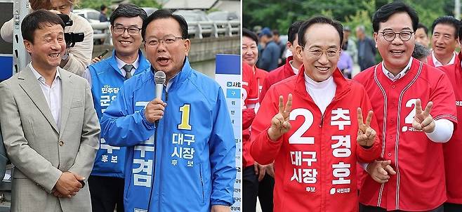 민주당 김부겸 대구시장 후보(왼쪽)와 국민의힘 추경호 대구시장 후보가 28일 대구 군위군 대구경북신공항 부지를 찾아 주민들과 만나고 있다. 연합뉴스