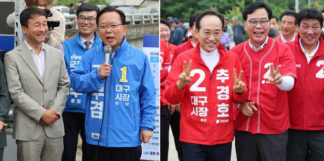 김부겸(왼쪽) 더불어민주당 대구시장 후보와 추경호(오른쪽) 국민의힘 대구시장 후보가 지난 5월 28일 대구 군위군 대구경북신공항 부지를 찾아 주민들과 만나고 있다. 민주당에선 한병도 원내대표, 국민의힘에선 송언석 원내대표가 각당 대구시장 후보 행보에 함께했다. [연합뉴스]