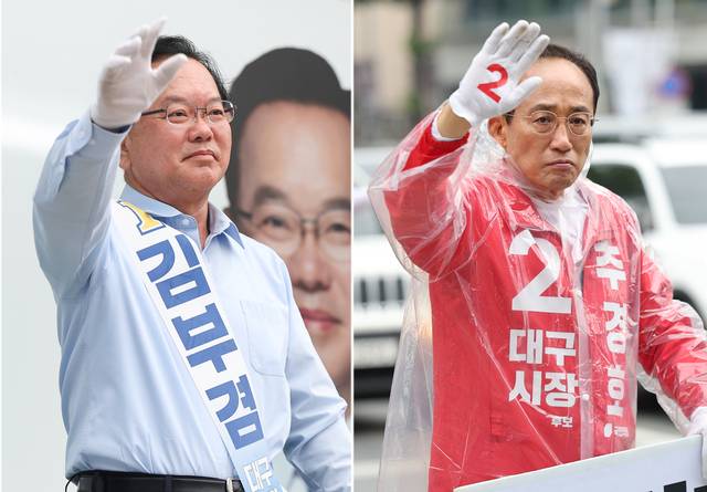 김부겸 더불어민주당 대구시장 후보(왼쪽)와 추경호 국민의힘 후보가 2일 대구 중구 반월당사거리와 북구 복현오거리에서 각각 아침 인사를 하고 있다. 연합뉴스