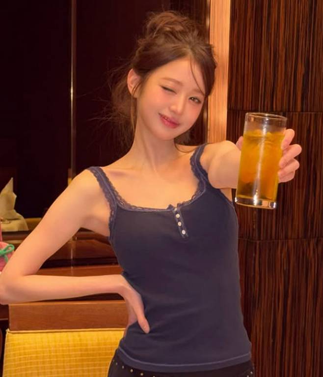 Jang Won-young, a member of the group IVE, has shared an update on her life for the first time in a while following the controversy over her behavior at the airport.On the 7th, Jang Won-young posted several photos on her social media account without any accompanying caption. In the photos, she is seen walking down a rainy street wearing a leather jacket paired with a skirt and holding a transparent umbrella. Her signature sophisticated aura and stylish visuals captured the attention of many.This post garnered particular attention as it was her first update since the recent airport controversy that erupted online. Jang Won-young shared a glimpse of her daily life as usual without commenting on the issue.At the time, she found herself at the center of controversy as footage spread showing her with her arms crossed during immigration screening and a scene where she appeared to snatch her passport with one hand from an airport staff member. While some netizens criticized her attitude as insincere, others argued that it was difficult to judge the situation based solely on a short video clip, leading to mixed reactions.In the released photos, Jang Won-young is seen enjoying a meal in casual attire with her hair neatly tied back. She spent a leisurely day sampling various dishes, including Peking duck.While Jang Won-young has not directly addressed the controversy, some netizens have focused on the phrase crying in the post. Some fans commented, Has she been going through a tough time recently due to various issues? and It might be a meaningless expression, but its still concerning, I hope shes managed to get through any difficult times, and I hope shes managed to get through any difficult times.Jang Won-youngs group, IVE, released their second full-length album, REVIVE+, last February and is currently meeting with fans both domestically and internationally through their world tour, SHOW WHAT I AM.