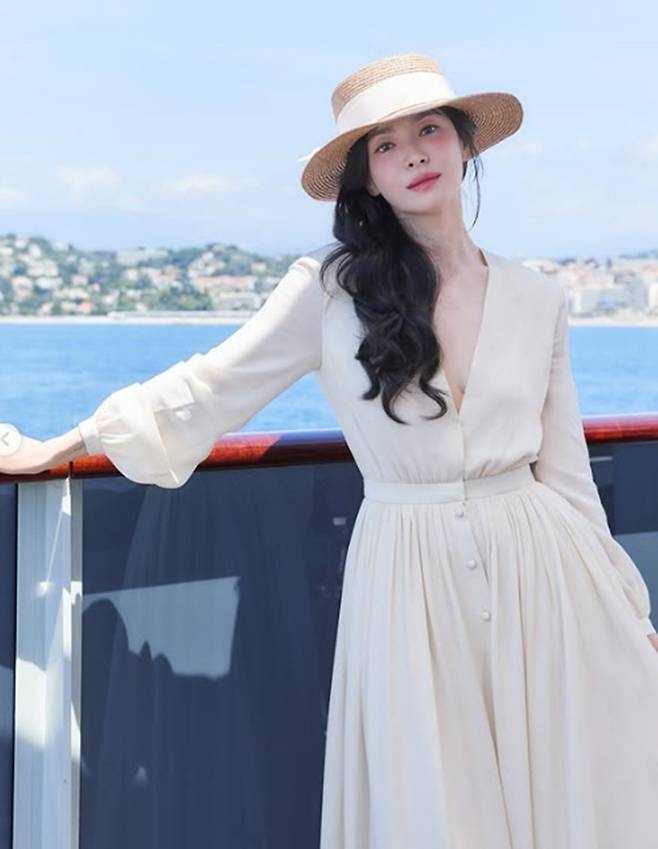 Actor Song Hye-kyo showed off her unchanging innocent charm by sharing recent photos taken during a cruise trip on her social media. In the released photos, Song Hye-kyo completed a sophisticated resort look by matching an ivory long dress with a straw hat.Song Hye-kyo created a classic atmosphere by pairing a deep V-neck dress with a wide-brimmed straw hat. In particular, her long, wavy black hair and subtle makeup further emphasized her signature pure image.In the close-up photos, her flawless skin and distinct features captivated attention. Even with her face partially covered by the straw hat, she boasted her unchanging beauty, drawing admiration from fans.Meanwhile, Song Hye-kyo appeared in the film *The Black Nuns* last year and plans to continue her acting career through the Netflix series *Slowly, Intense*, which is scheduled for release this year.