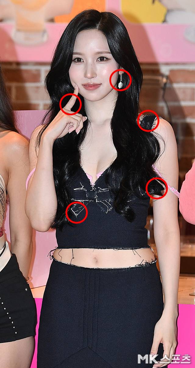 TWICE member Mina showcased a unique fashion style while attending a tea brand event held in Gwanghwamun, Jongno-gu, Seoul on June 18. On this day, Mina exuded a sophisticated vibe by styling a black sleeveless top with a long skirt and creating a bold underwear layered look that revealed pink bra straps.