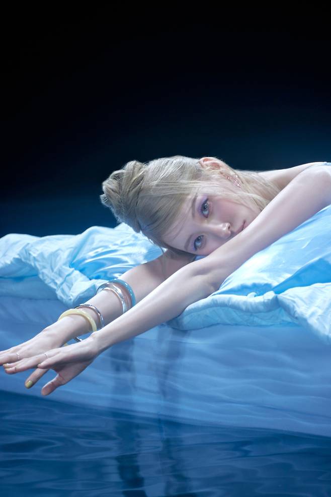 Singer Sunmi has unveiled concept photos for her new digital single Forever July, set to be released on the 15th, showcasing her unrivaled charm. Sunmi perfectly pulled off a diverse range of styling that oscillated between refreshing and dreamy atmospheres, proving once again that she is a master of concept art.In the released photos, Sunmi displayed a wide spectrum of styles, ranging from a wistful sensibility utilizing summer rain and umbrellas to a free-spirited look paired with ripped denim. In particular, the dreamy staging utilizing light against a dark background evoked an atmosphere reminiscent of a fantasy film, piquing curiosity about the new song.Sunmi has consistently established her own unique musical domain with distinctive visuals and original concepts for every album. With this new song, Forever July, she is garnering anticipation from fans by signaling a new transformation that transcends genres.Sunmis new digital single, Forever July, is scheduled for official release on various online music sites on the 15th.