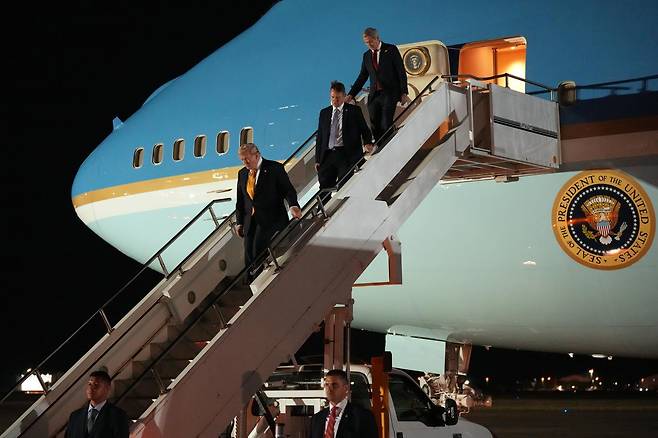 President Donald Trump switches planes at U.S. Air Force Base, RAF Mildenhall in Suffolk Eastern England, on his way back to Washington from the NATO summit in Ankara, Turkey, Wednesday, July 8, 2026. (AP Photo/Alex Brandon)