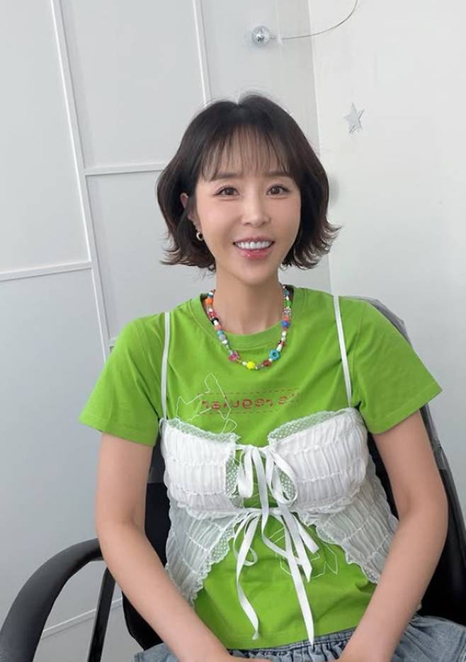 Singer Shin Ji shared a photo on her social media expressing her excitement ahead of her first performance in a long time. Ahead of the show, Shin Ji flashed a bright smile, showing her dedication to her career as a singer.In the photo, Shin Ji paired a green short-sleeved T-shirt with a sky-blue lace skirt to create a fresh and vibrant look. She also showcased an outfit accented with a beaded necklace and expressed her joy by striking a V sign for the camera.Meanwhile, Shin Ji garnered significant attention last month after marrying singer Moon Won.