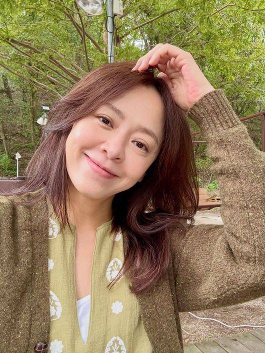 Actress Kang Sung-yeon went on a family trip following her remarriage to her husband, neurologist Jang Min-wook.On the 13th, Kang Sung-yeon posted on her social media, Ive recharged again like this, our family has become stronger, and so Im planning another camping trip in October. The power of camping is truly great~~~.In the accompanying video and photos, Kang Sung-yeon is seen enjoying a happy time with her two sons and husband, Jang Min-wook.In particular, Kang Sung-yeon is showing off her youthful beauty, making it hard to believe she is 50 years old this year. In response, her close friend, actress Park Tam-hee, commented, Are you planning to be lovely forever?Kang Sung-yeon previously announced her remarriage to Jang Min-wook last May. At the time, she expressed her deep affection for her husband, saying, Throughout this long time, I was able to smile because you were there to comfort and protect my aching heart. You are the one who gifted me the strength and time to live on again. She also added, Everything I do with you feels like a miracle. Lets live affectionately and peacefully, filled with deep consideration and trust for each other, and I am truly grateful, respectful, and love you.Kang Sung-yeons husband is known to be Dr. Jang Min-wook, a neurologist. Dr. Jang is the director of the Brain Navigation Neurology Clinic and has lectured across all fields of neurology, including headaches, dementia, and brain aging, and has appeared on programs such as KBSs *Morning Plaza*. He previously worked with Kang Sung-yeon on the JTBC show *Doctors Talk* in 2022.Kang Sung-yeon married jazz pianist Kim Ga-on in 2012 and had two sons, but announced their divorce in 2023, ten years after their marriage. She has since received many congratulations after announcing her remarriage about three years later.Jang Min-wook, who appeared on MBNs *Dongchimi* last July, said, When we first met, Kang Sung-yeons mother had a very severe headache.Jang Min-wook smiled shyly and said, It hadnt been long since my wife went through the pain of divorce, and I had experienced similar pain. On top of that, my elderly parents were ill. Jang Min-wook shared his happy current status, adding, Raising two children now, I didnt realize my life could be this happy.Kang Sung-yeon SNS, video capture