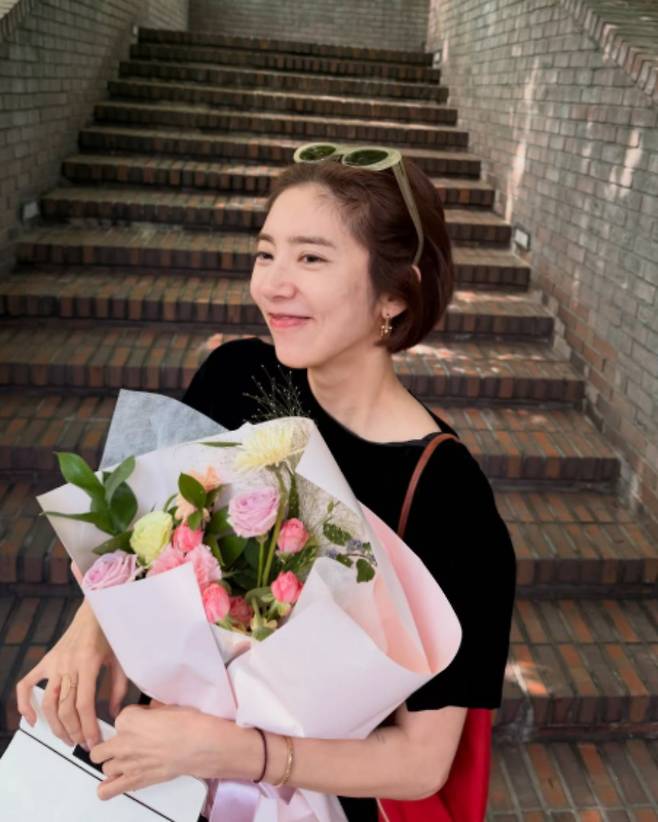 Singer and actress Son Dam-bi expressed her gratitude while showing off the birthday eve celebration prepared by her husband, Lee Kyu-hyuk.On the 23rd, Son Dam-bi posted several photos on her personal channel along with the caption, Is it okay to be this happy right from the birthday eve?In the photos, Son Dam-bi is seen smiling brightly while holding a large bouquet of flowers, which appears to have been a gift from her husband, Lee Kyu-hyuk.Matching a black mini dress with sunglasses, Son Dam-bi completed a sophisticated look, revealing her slender legs. In another photo, she showed off their still-sweet marital relationship by leaning her face close to Lee Kyu-hyuks and pouting her lips.In particular, Son Dam-bi expressed her gratitude to Lee Kyu-hyuk for pouring his heart into preparing for her starting the day before her birthday.She stated, From the restaurant he chose for me to the flowers and the cake. Seeing the thoughtfulness my husband put into preparing every single detail, this years birthday was touching right from the start.She continued, It has already been five years since we started celebrating birthdays together. In the meantime, Hae-yi joined us, so now the three of us are blowing out the candles together, expressing her affection for her family. Today, being able to smile and say thank you to each other with the two people I love the most—I will remember this warmth for a long, long time.Finally, Son Dam-bi cheerfully added to Lee Kyu-hyuk, Honey, thank you. Please do the birthday eve party again next year, expressing her satisfaction with her husbands surprise.Meanwhile, Son Dam-bi married former national speed skating team member Lee Kyu-hyuk in 2022 and welcomed a daughter last April.Photo = Son Dam-bi