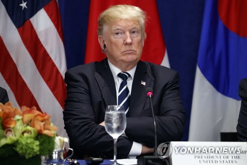 President Donald Trump listens during a luncheon with South Korean President Moon Jae-in and Japanese Prime Minister Shinzo Abe, at the Palace Hotel during the United Nations General Assembly, Thursday, Sept. 21, 2017, in New York. (AP Photo/Evan Vucci)