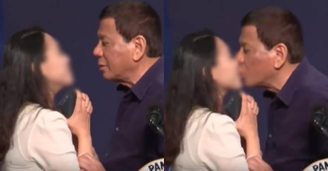 로드리고 두테르테 필리핀 대통령이 지난 3일 서울의 한 호텔에서 열린 자국 교민 행사에서 한 여성에게 책 선물을 주면서 키스를 하고 있는 모습. Rappler/유튜브 캡처