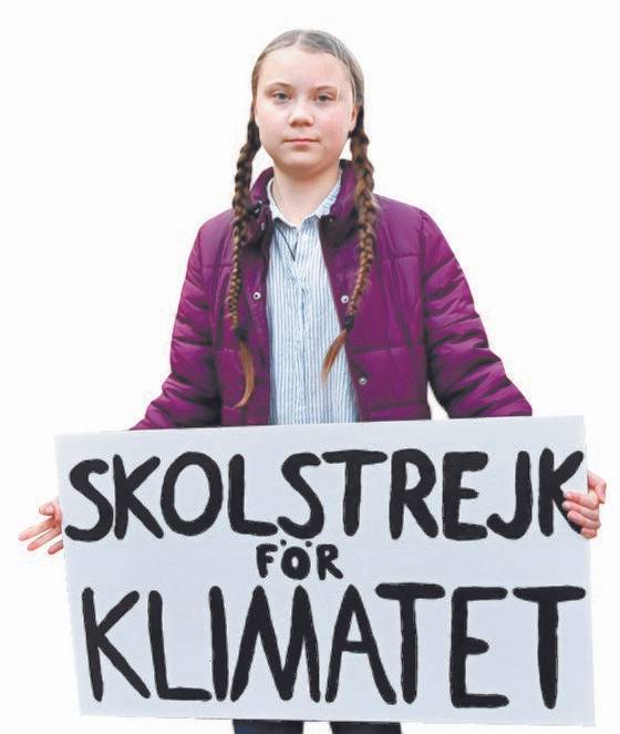 그레타 툰베리가 2월 21일 '기후를 위한 스쿨 파업'이라는 팻말을 들고 벨기에 브뤼셀을 행진하고 있는 모습. [AP=연합뉴스]