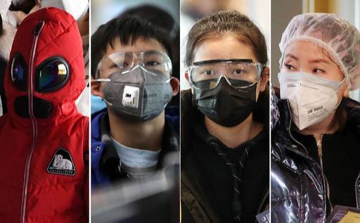 29일 중국에서 인천국제공항 1터미널로 입국한 승객들이 신종 코로나바이러스 감염증(우한 폐렴)에 대비해 산업용 보호안경을 착용하거나 샤워캡과 마스크를 쓰는 등 안전에 만전을 기한 모습을 보이고 있다. 인천공항=하상윤 기자