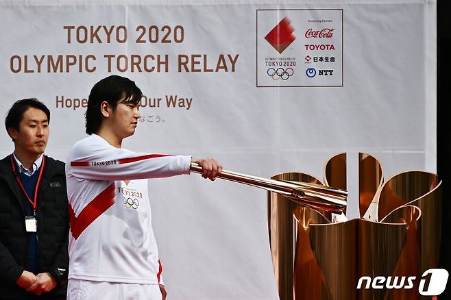일본 도쿄에서 올림픽을 대비해 성화 봉송 행사 리허설을 진행하고 있다. © AFP=뉴스1