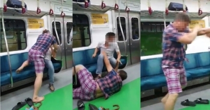 지난 27일 오전 출근길 지하철 2호선 내에서 50대 A씨가 마스크 착용을 요구하는 다른 승객을 폭행하는 장면을 담은 영상이 유튜브에 올라왔다. 유튜브 캡쳐