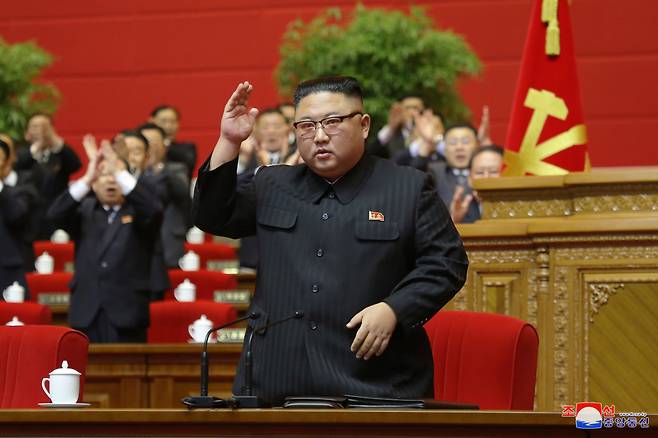 North Korean leader Kim Jong-un waves to officials attending the final day of the eighth congress of the ruling Workers` Party in Pyongyang on Tuesday. (KCNA-Yonhap)