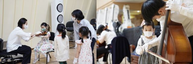서울시향 단원들이 15일 세종문화회관 연습동 내 리허설룸에서 열린 악기 체험 행사에서 아이들에게 악기를 만져보거나 소리내도록 돕고 있다.   서울시향 제공
