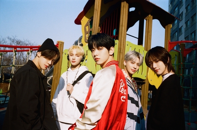 Group TOMORROW X Twogether is continuing its comeback with the second concept photo of its new album, Chaos Chapter: FREEZE.TOMORROW X Twogether (Subin, Yeonjun, Bumgyu, Taehyun, and Huning Kai) released the second concept photo BOY version on the official SNS channel at 0:00 on May 18.Like the last WORLD version, the mood teaser was pre-released, raising expectations for concept photos.The mood teaser added curiosity to the message, with the phrase BOY, a courier box stacked Twogether, a table with food, a bed with a headset, a comic book piled up in a fence, and a bed full of figures and dolls.The space of question revealed in the public concept photo is the place where the members spend their daily life.Subin, who has a lot of courier boxes but seems indifferent to them, Yeonjun, who has piled up without removing the food he ate, and Bum-gyu, who is crouching in the blanket and listening to music.And Taehyun and Kai, each holding a comic book in a fence, are thinking differently or looking at their phone in a dark room, giving a quiet, calm atmosphere.In a group photo set in a playground, Taehyun and Bumgyu, along with Yeonjun, who is biting candy, and Kai, who wears a headset, and Subin, who is expressionless without laughter, have a chic and relaxed smile and create the same space, but each atmosphere is different.If the concept photo of the previously released WORLD version contains members in the desolate ruins, this BOY version captured members who are spending their time alone in ordinary spaces such as playgrounds and houses.The ordinary everyday but expressionless members show a somewhat subdued atmosphere. Especially, this concept photo was shot with a film camera and added a unique feeling.TOMORROW X Twogether, which has been receiving the attention of fans around the world by releasing the concept photo of the BOY version following the WORLD version, will show the last concept photo, YOU version, on the 20th, starting with the concept trailer on the 11th.TOMORROW X Twogethers second Regular album, Chaos Chapter: FREEZE, will be released on the 31st.The album broke its own record once again, recording 520,000 pre-orders in just six days.