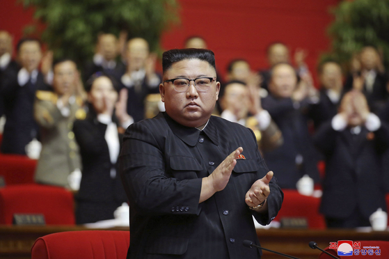 In this Jan. 10 file photo provided by the North Korean government, North Korean leader Kim Jong-un claps his hands at the ruling party congress in Pyongyang, North Korea. Korean language watermark on image as provided by source reads: ″KCNA″ which is the abbreviation for Korean Central News Agency. [KCNA/AP]