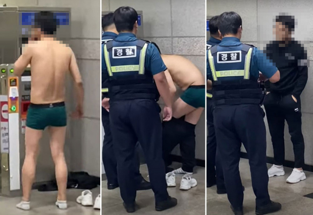 지난 19일 오후 경춘선 남춘천역에서 속옷만 입고 소란을 피운 남성을 경찰이 제지하고 있다. /유튜브 캡처