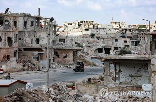 내전으로 파괴된 시리아 다라 주의 건물  [AFP=연합뉴스 자료사진]
