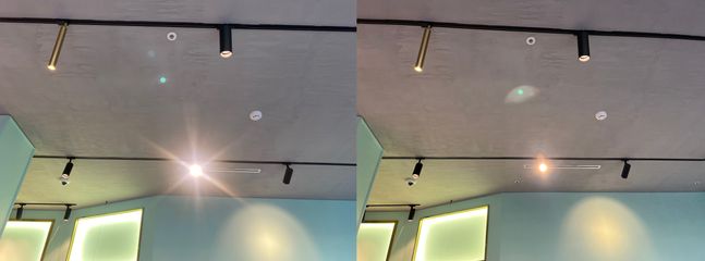 애플 스마트폰 ‘아이폰11’(왼쪽)과 ‘아이폰13’으로 촬영한 사진. 조명 빛 번짐 현상은 개선됐으나 초록색 점 형태로 빛의 잔상이 나타나는 고스트(플레어) 현상은 여전히 남아있다.ⓒ데일리안 김은경 기자